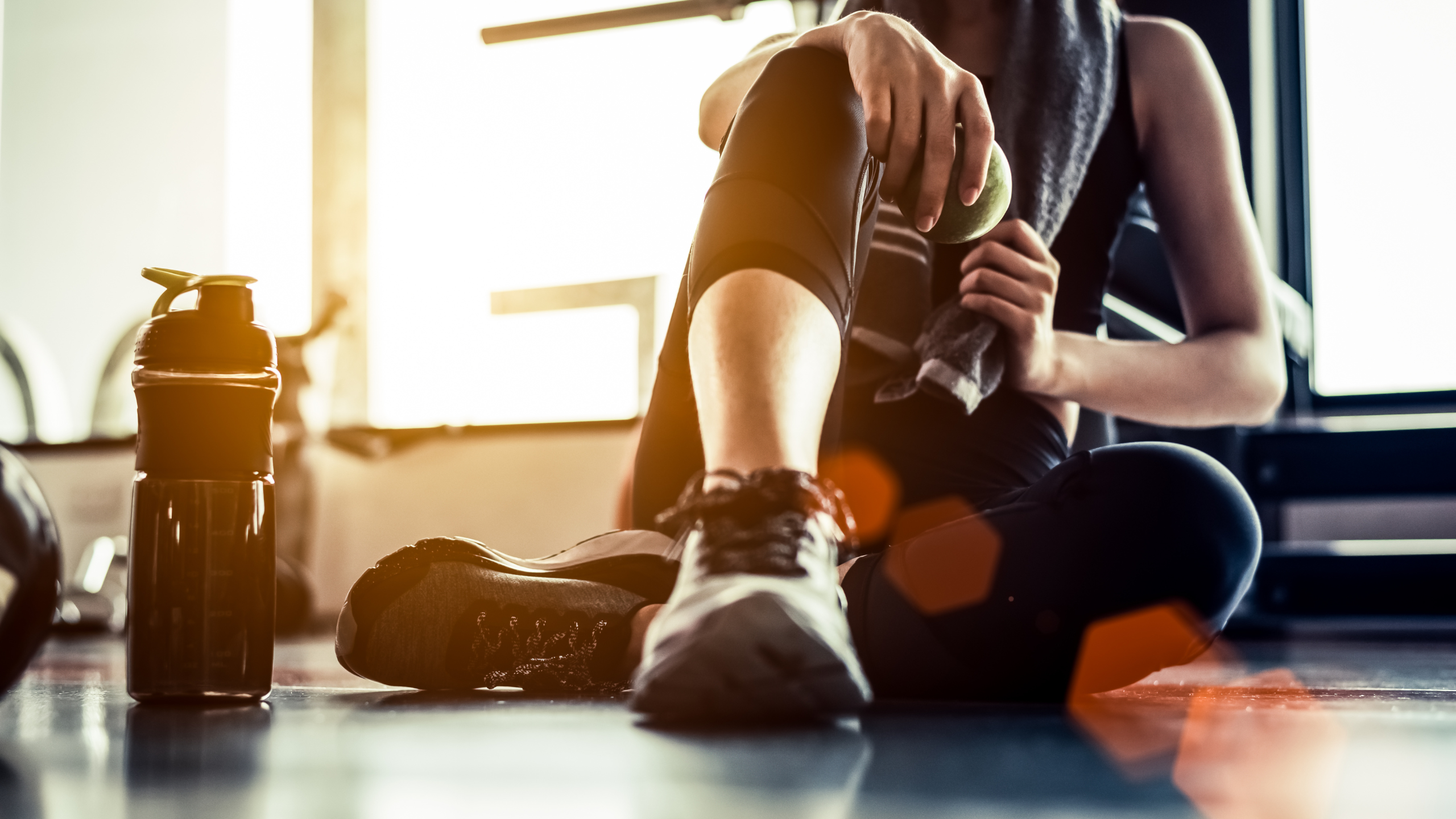 woman at the gym with water bottle