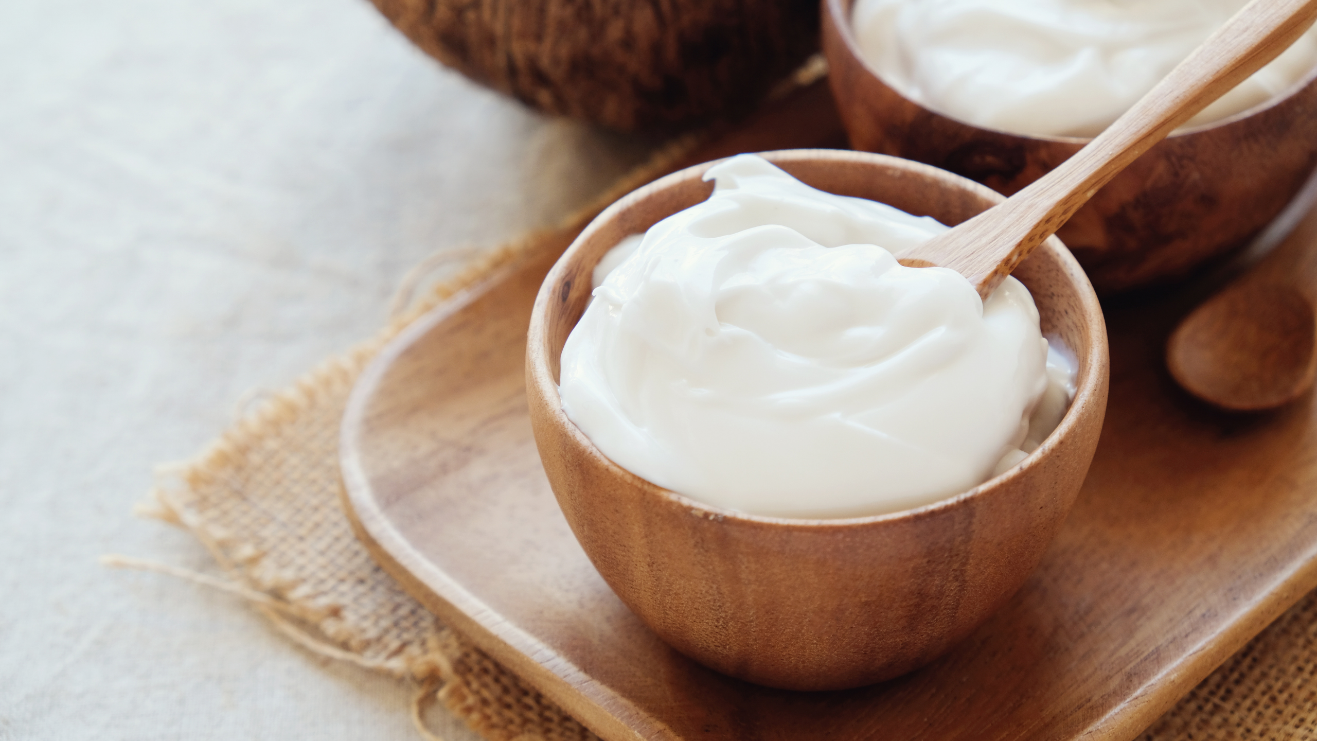 Yogurt in a wooden bowl