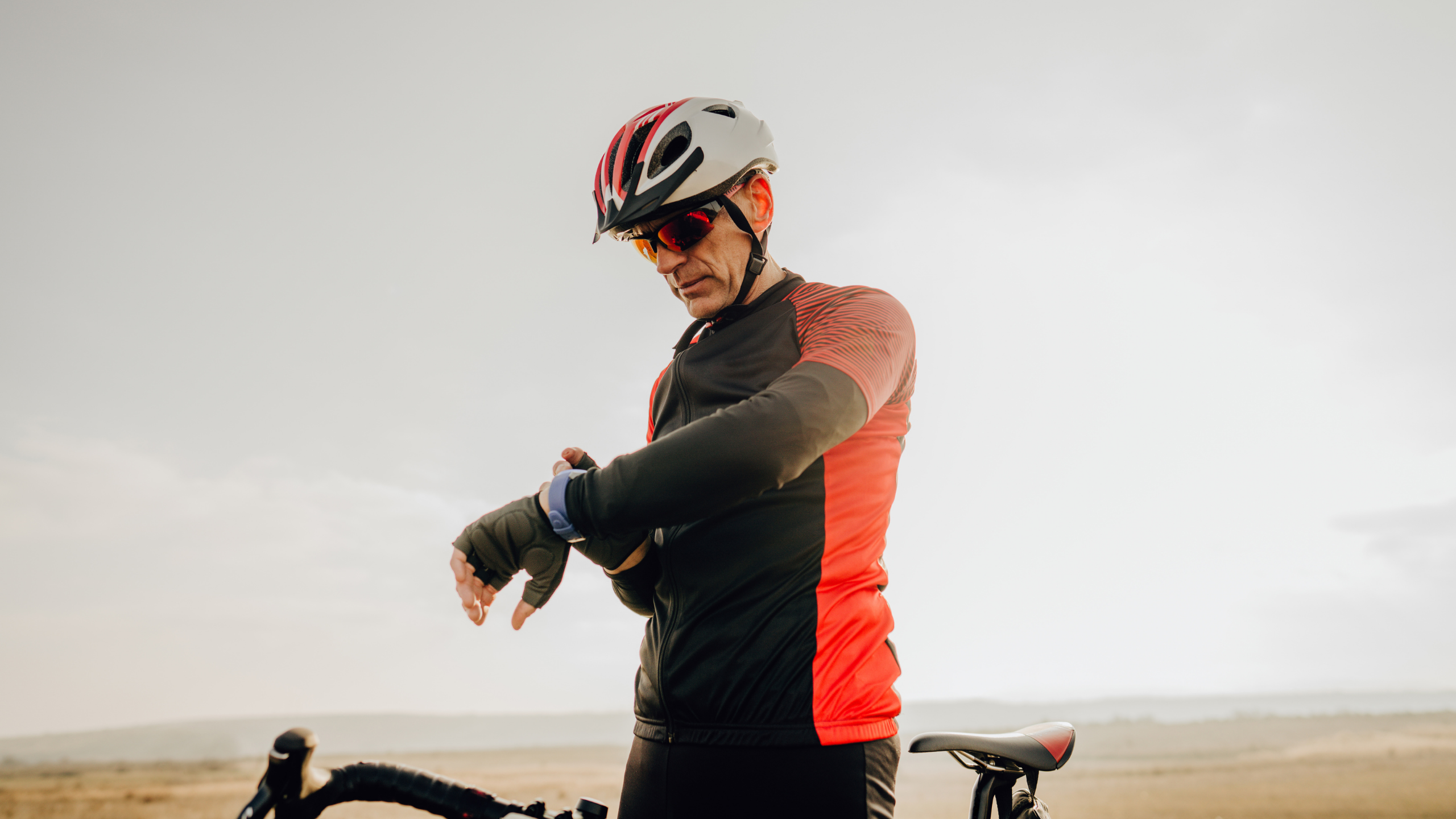 Cyclist checking watch