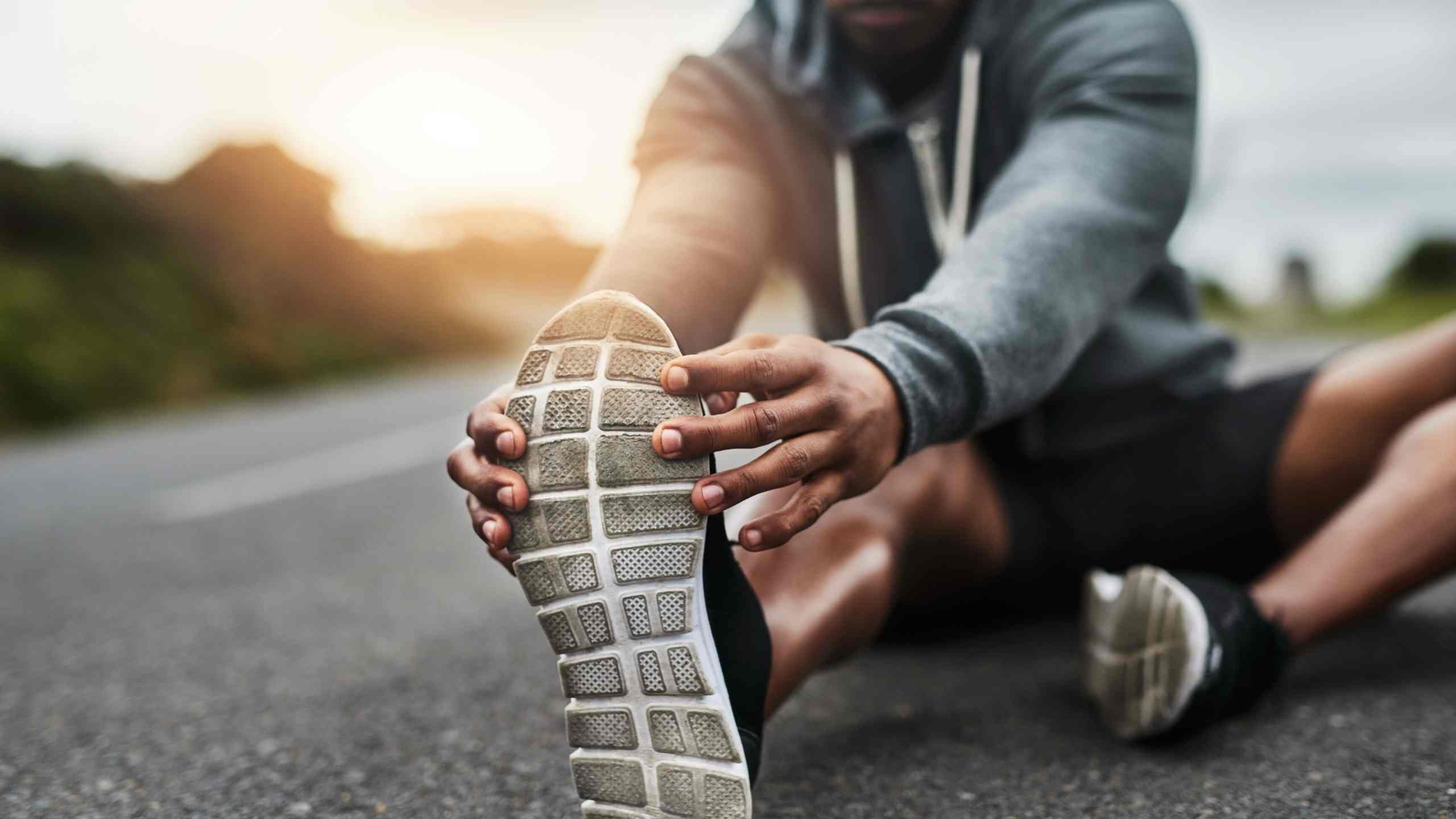 man stretching after a run