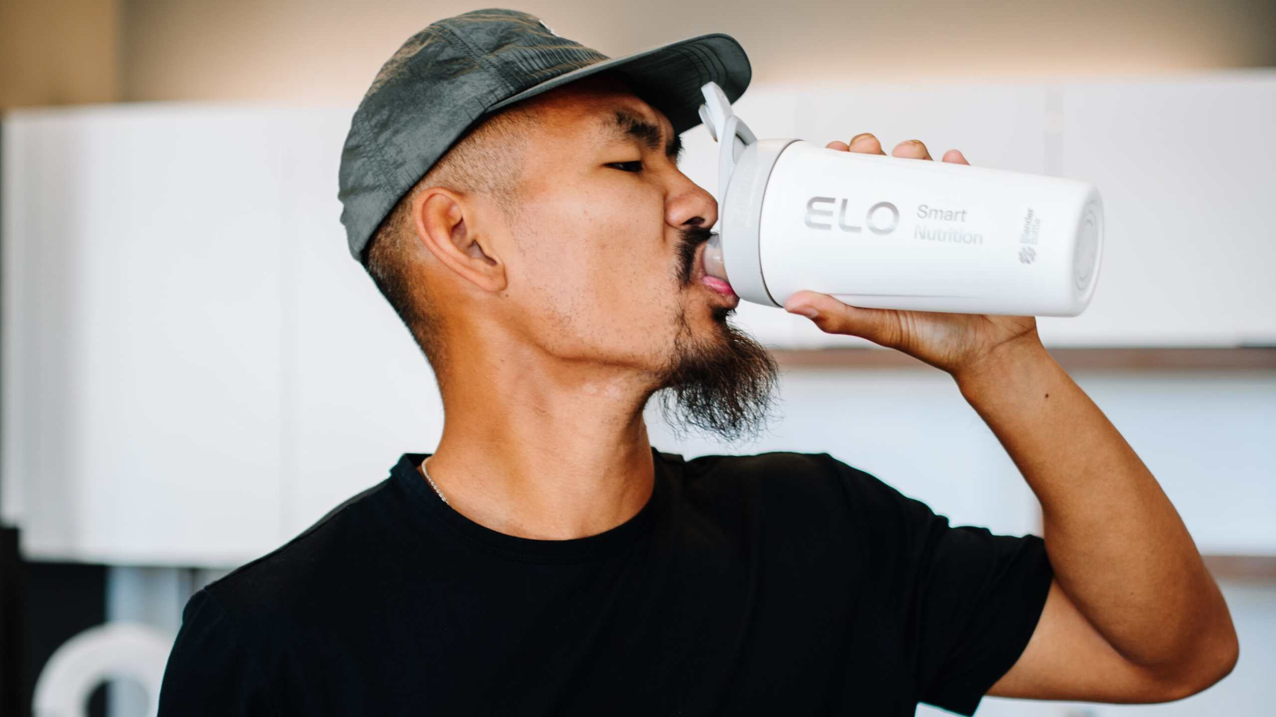 toan drinking protein in kitchen