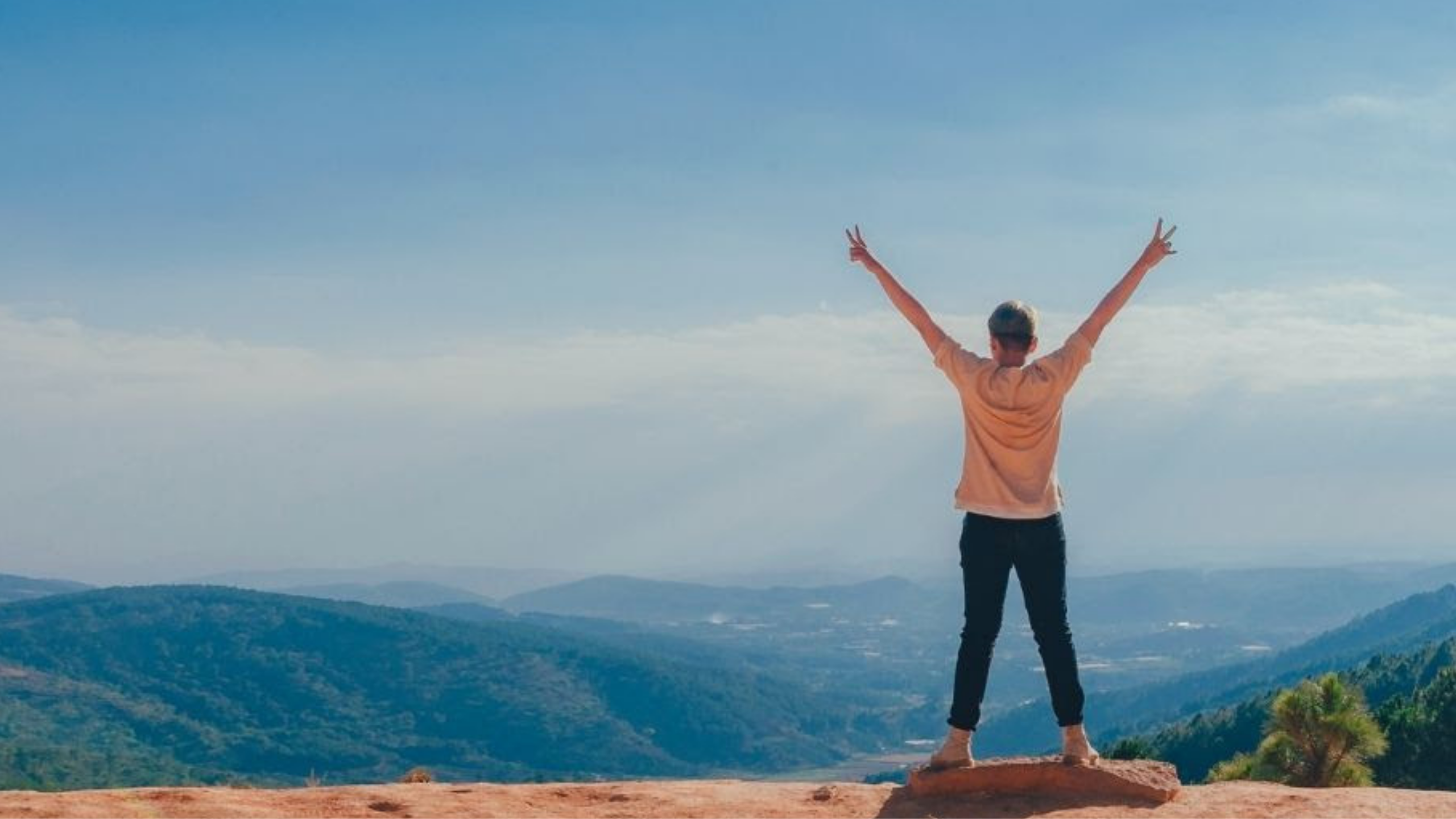 woman standing on a mountain