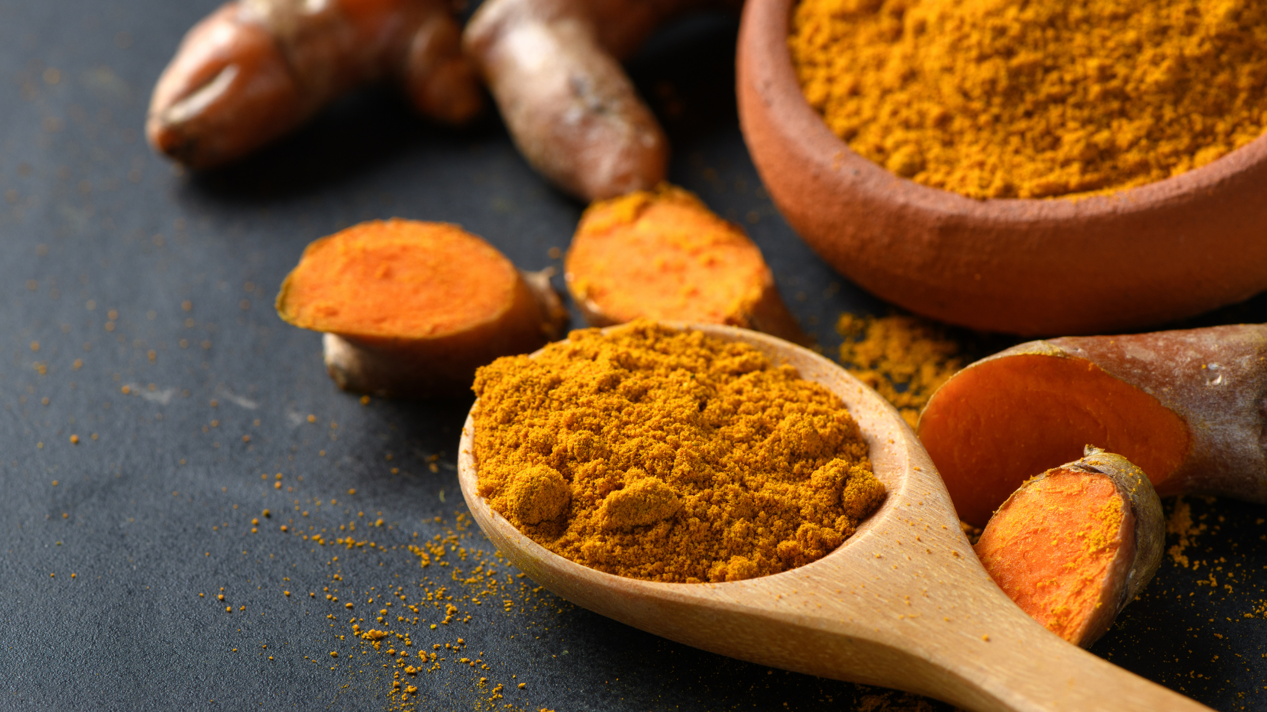 Ground turmeric in a spoon